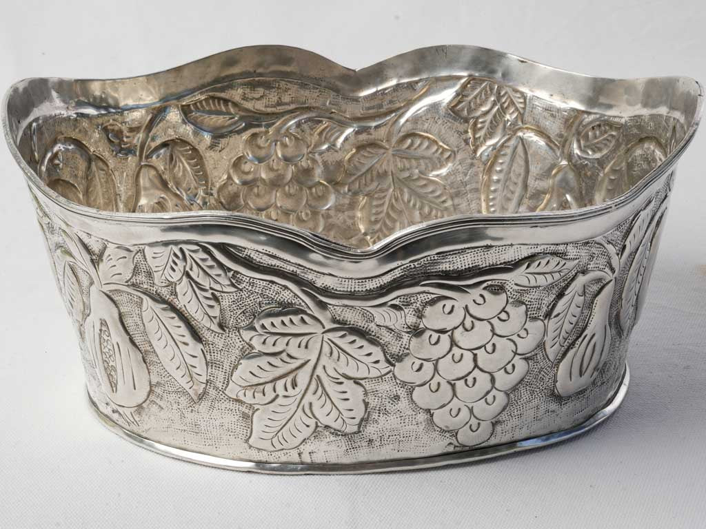 Embossed fruit motif basin