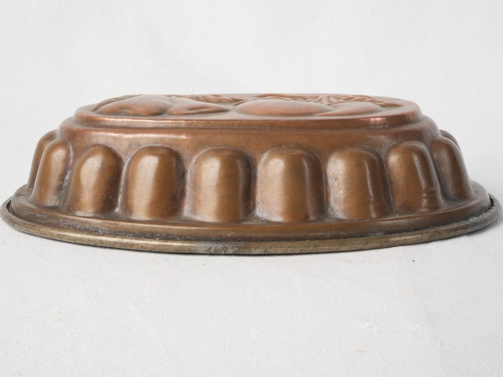 Patina-rich repoussé copper design