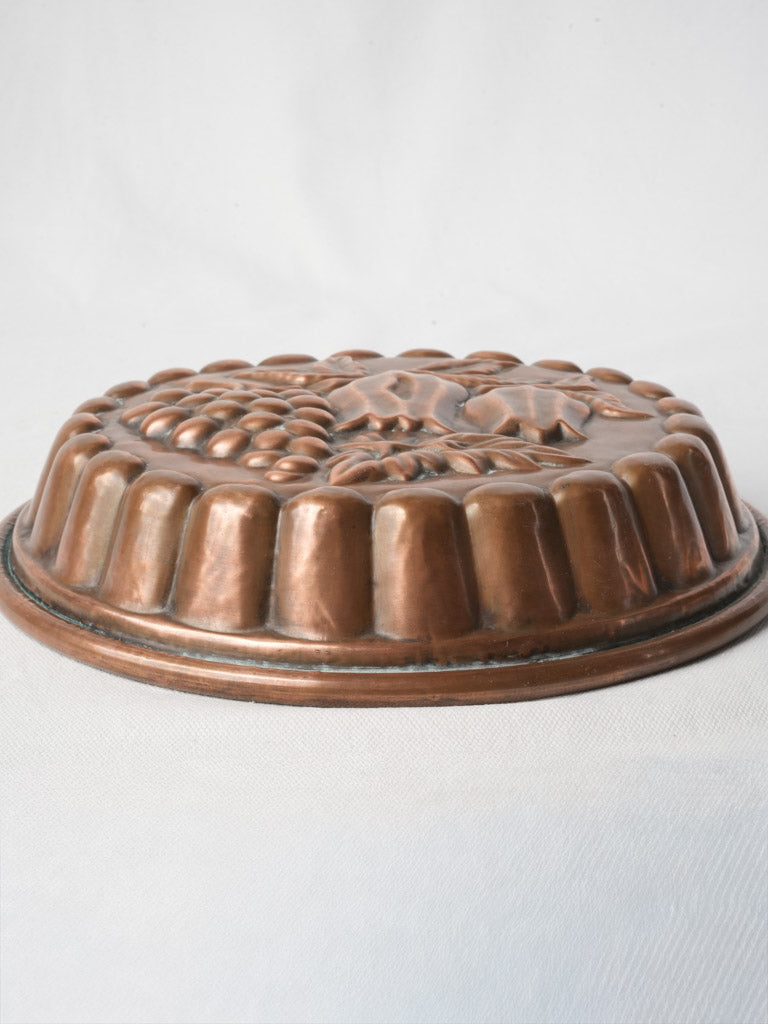 Aged gadrooned copper pastry mold  