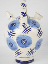 Antique white floral-designed pottery cruche