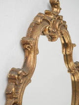 Elaborate scrolled acanthus gold mirror