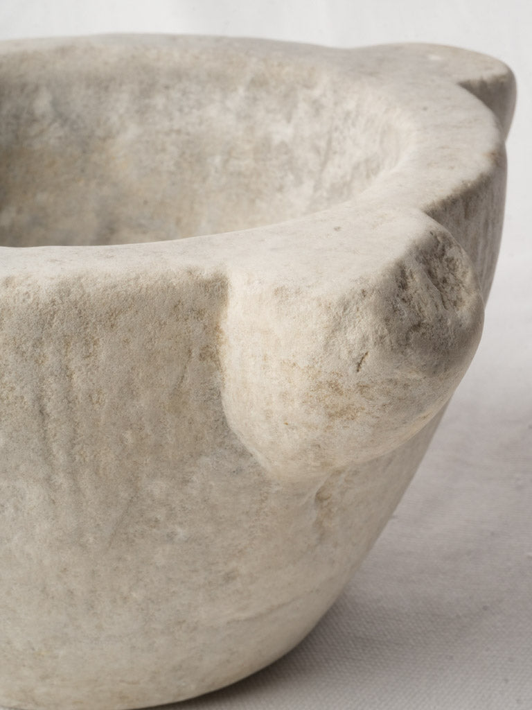 Softened patina mortar artifact