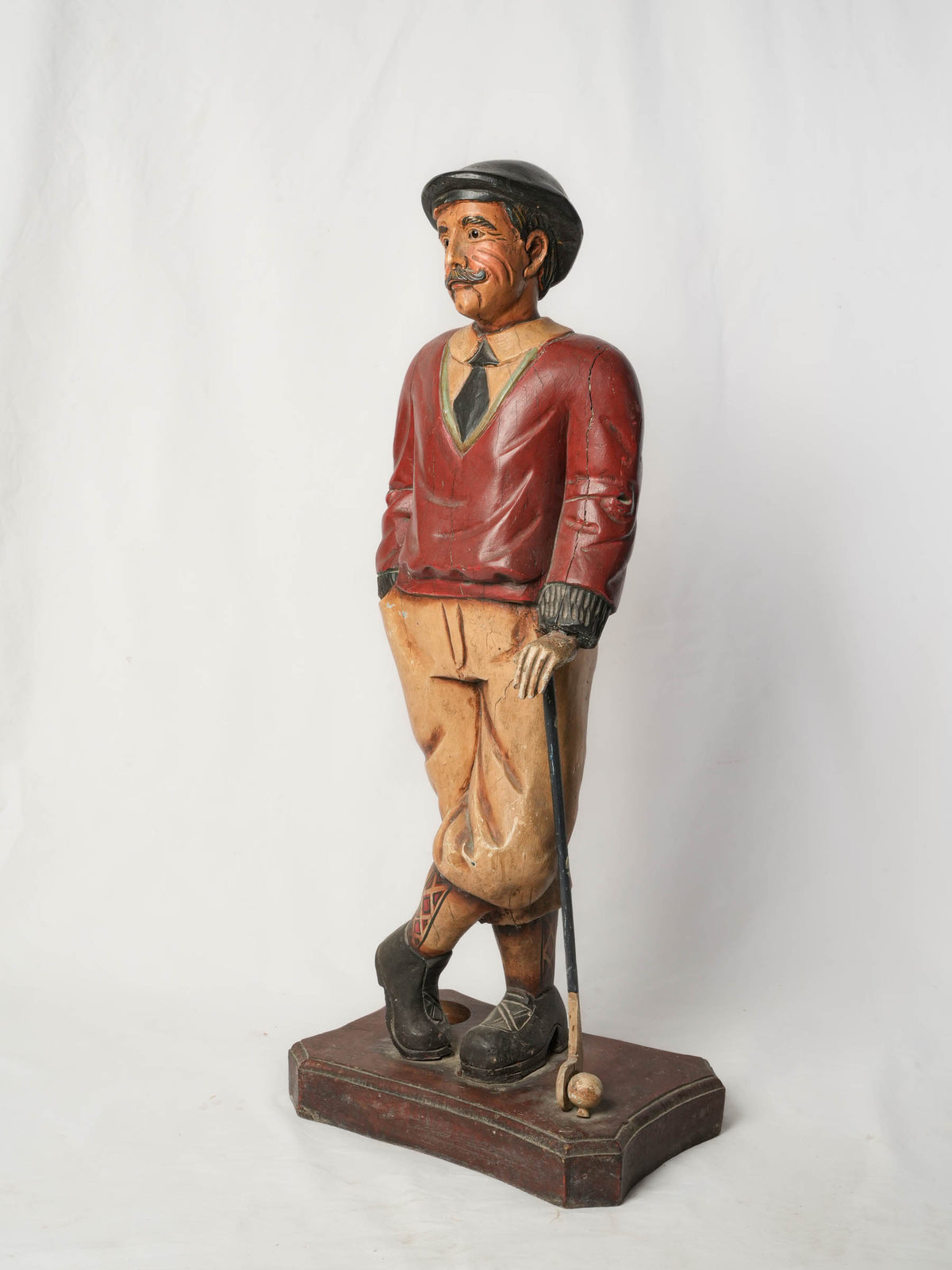 Hand-carved wooden sportsman figure  