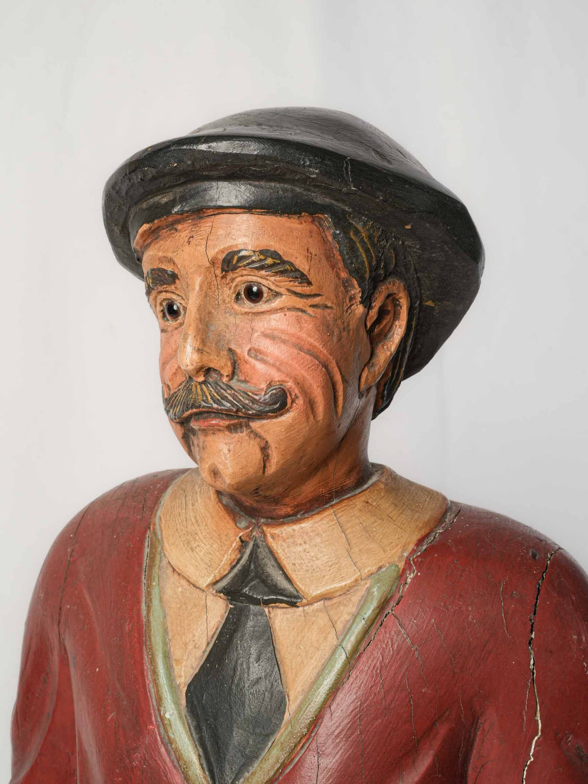 Warm-toned wooden golfer sculpture  