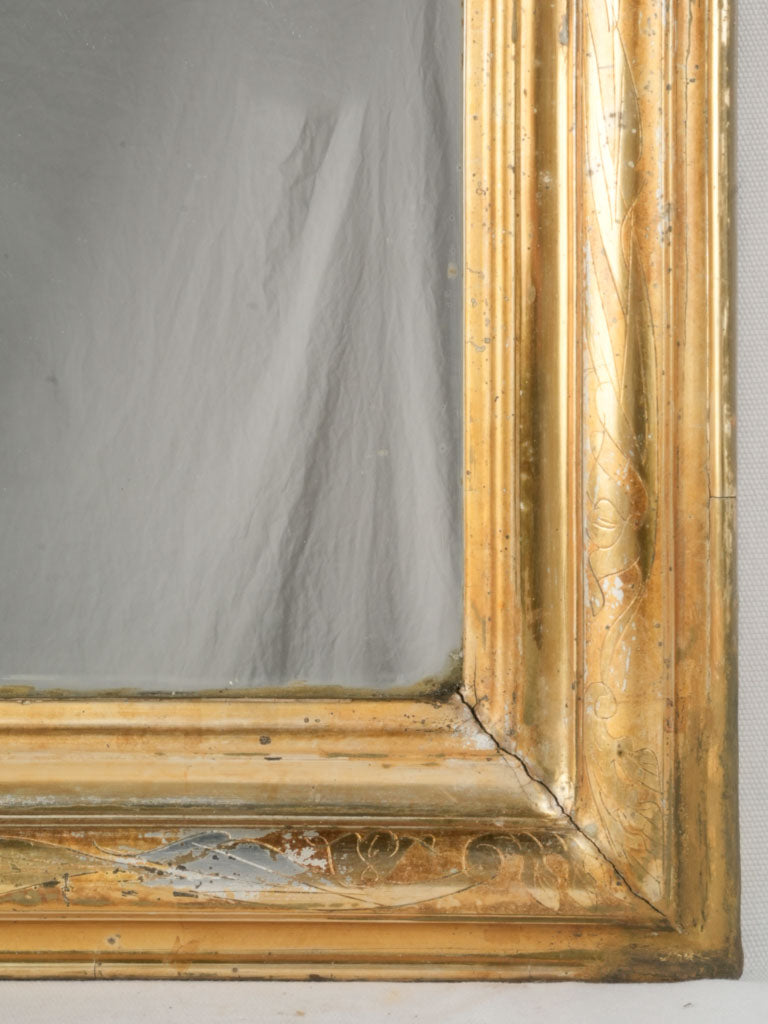 Time-worn French decorative wall mirror
