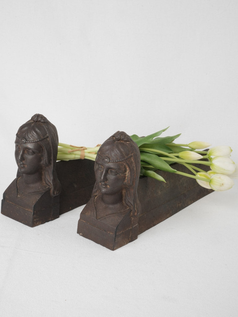 Antique Egyptian-themed cast iron firedogs