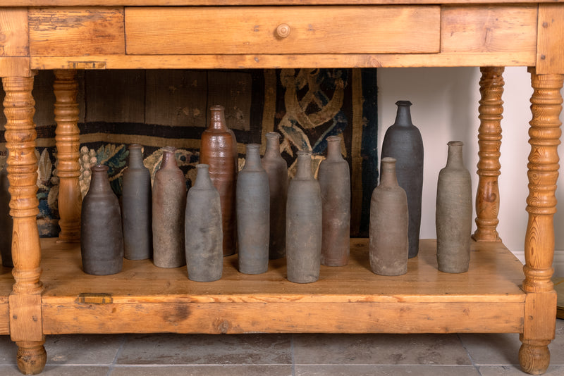 Collection of 12 terracotta long bottles from Normandy 11¾"