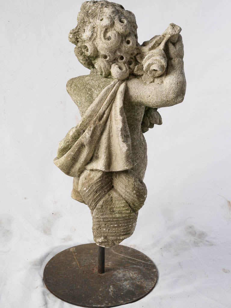 Weathered patina stone figure  