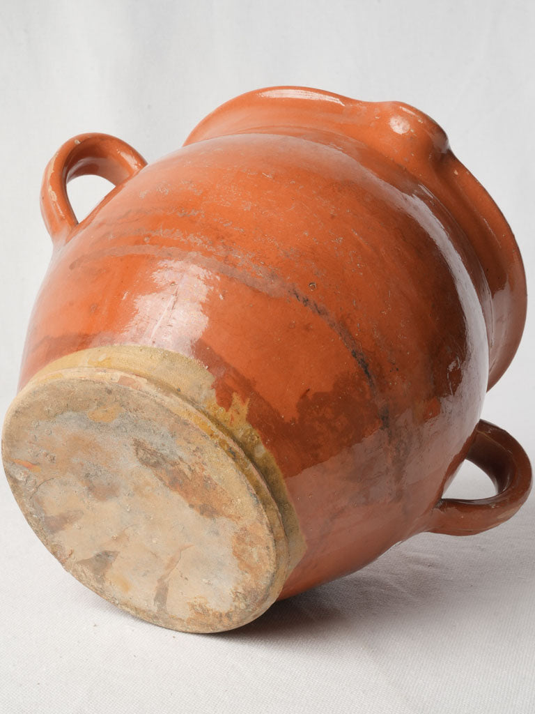 Warm, earthy-toned spout jar