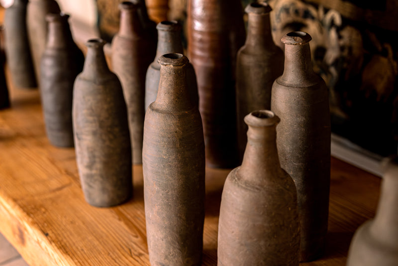 Collection of 12 terracotta long bottles from Normandy 11¾"