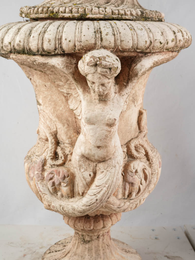 Elegantly styled terracotta lidded urns