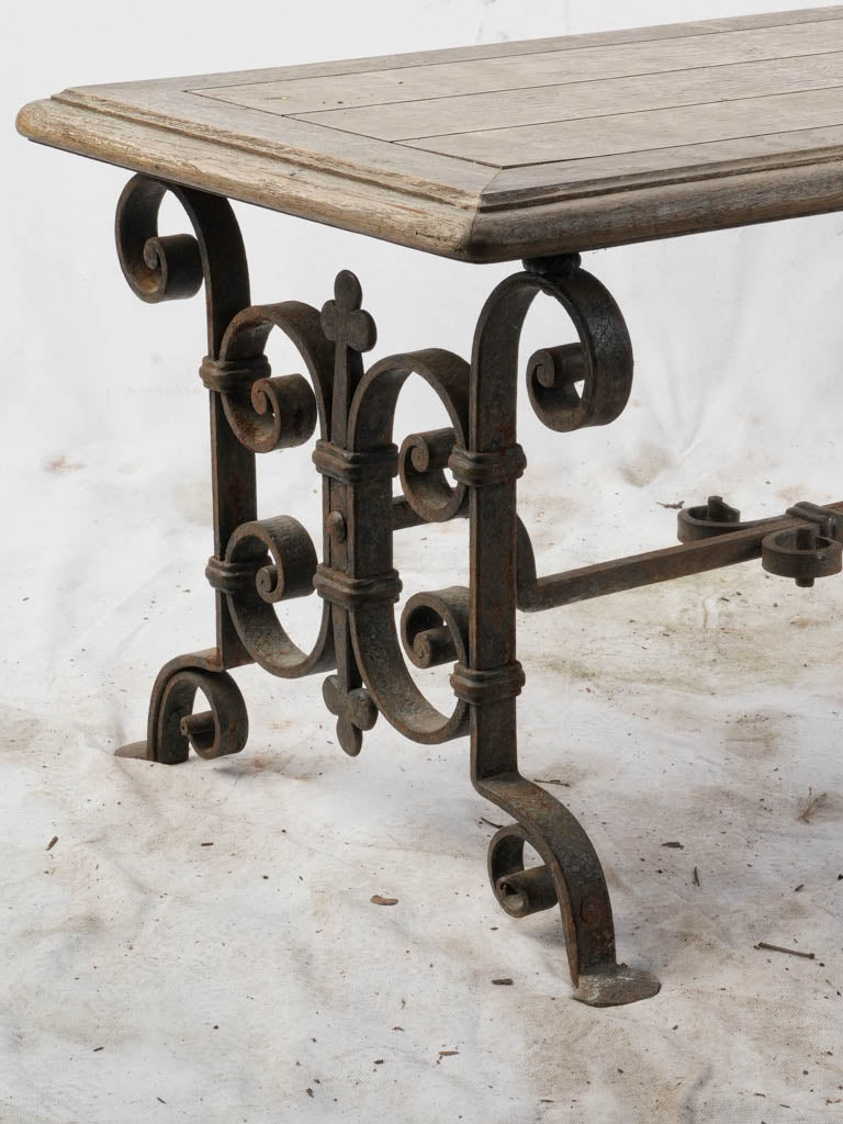 Ornate wrought iron-legged seating