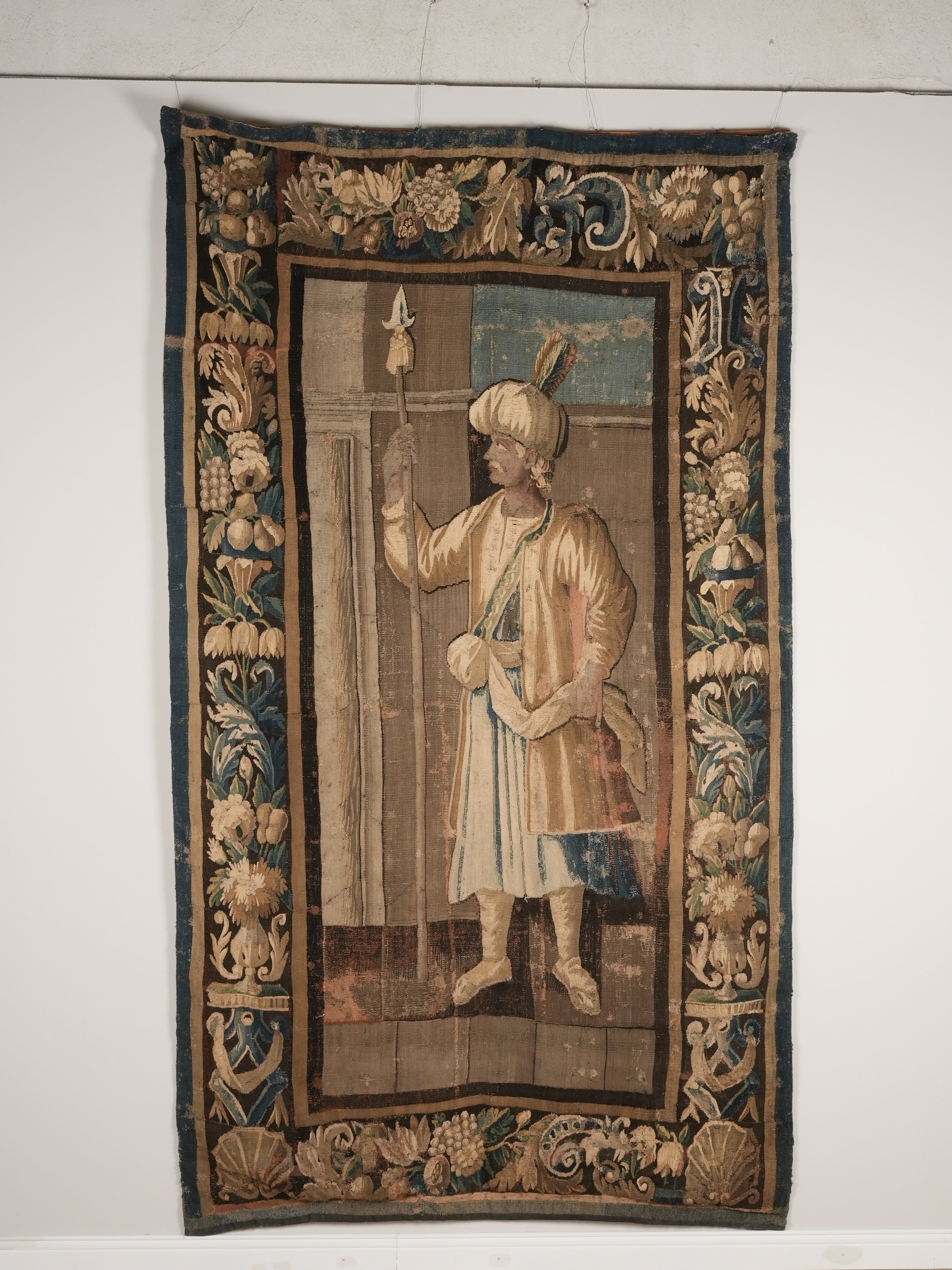 Elegant antique tapestry with repairs