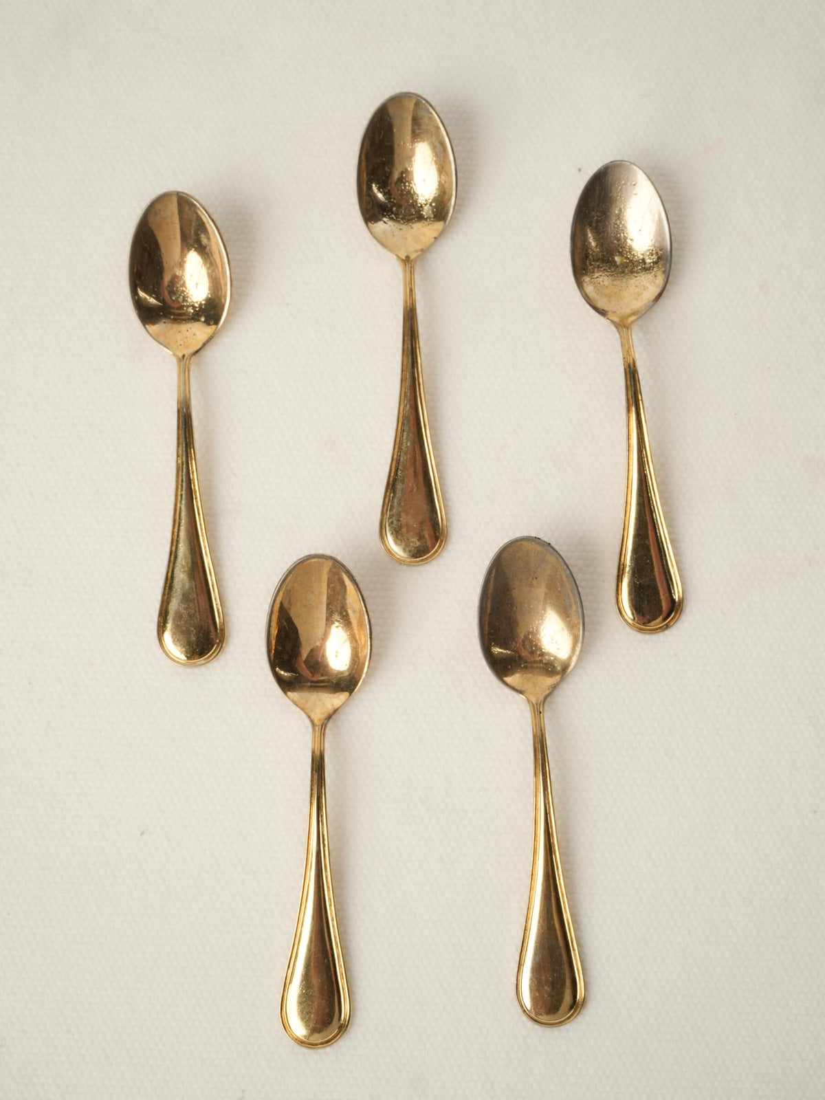 Set of five caviar spoons with gold patina