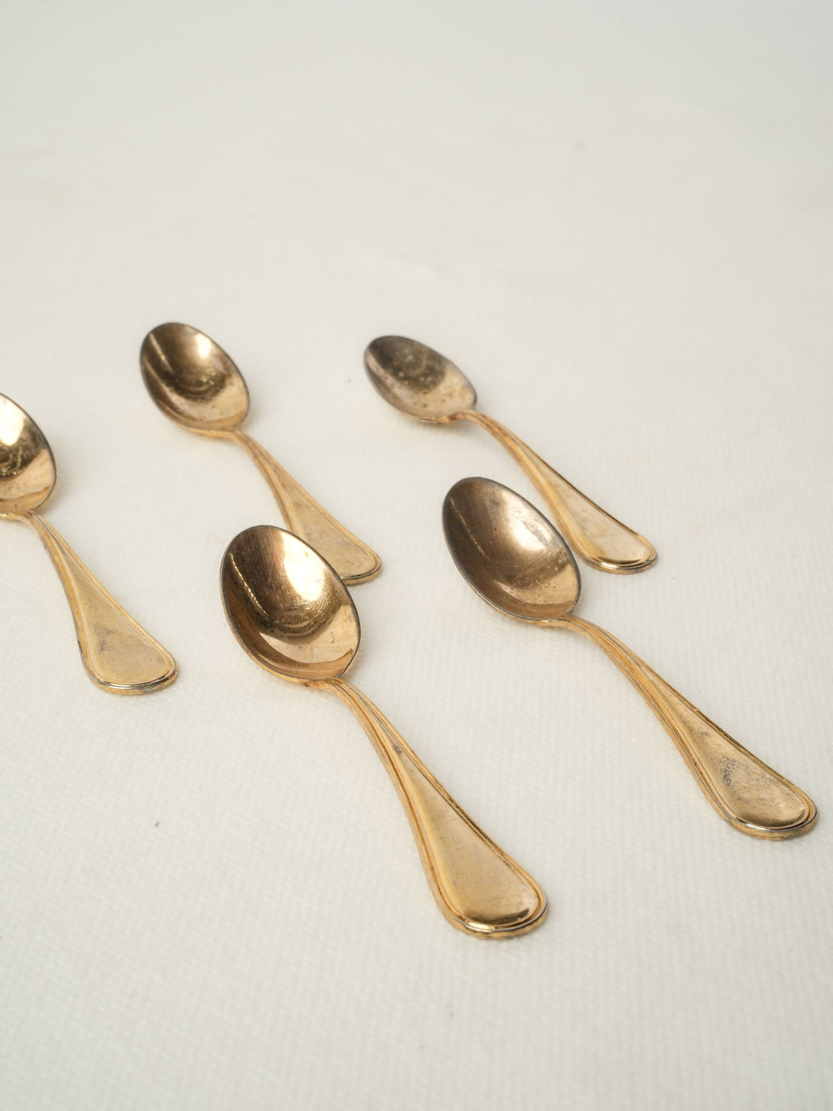 Set of five caviar spoons with gold patina