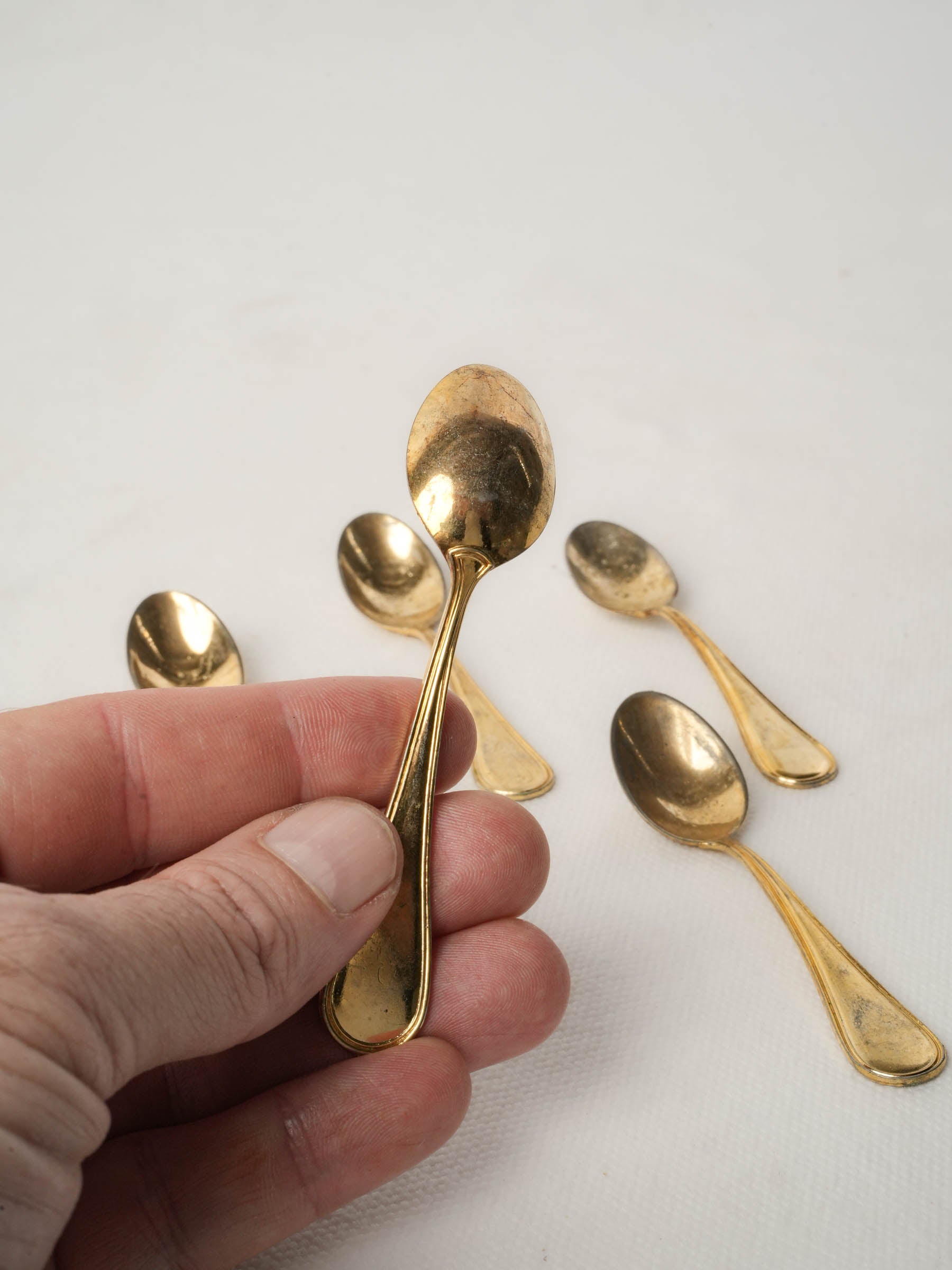 Set of five caviar spoons with gold patina