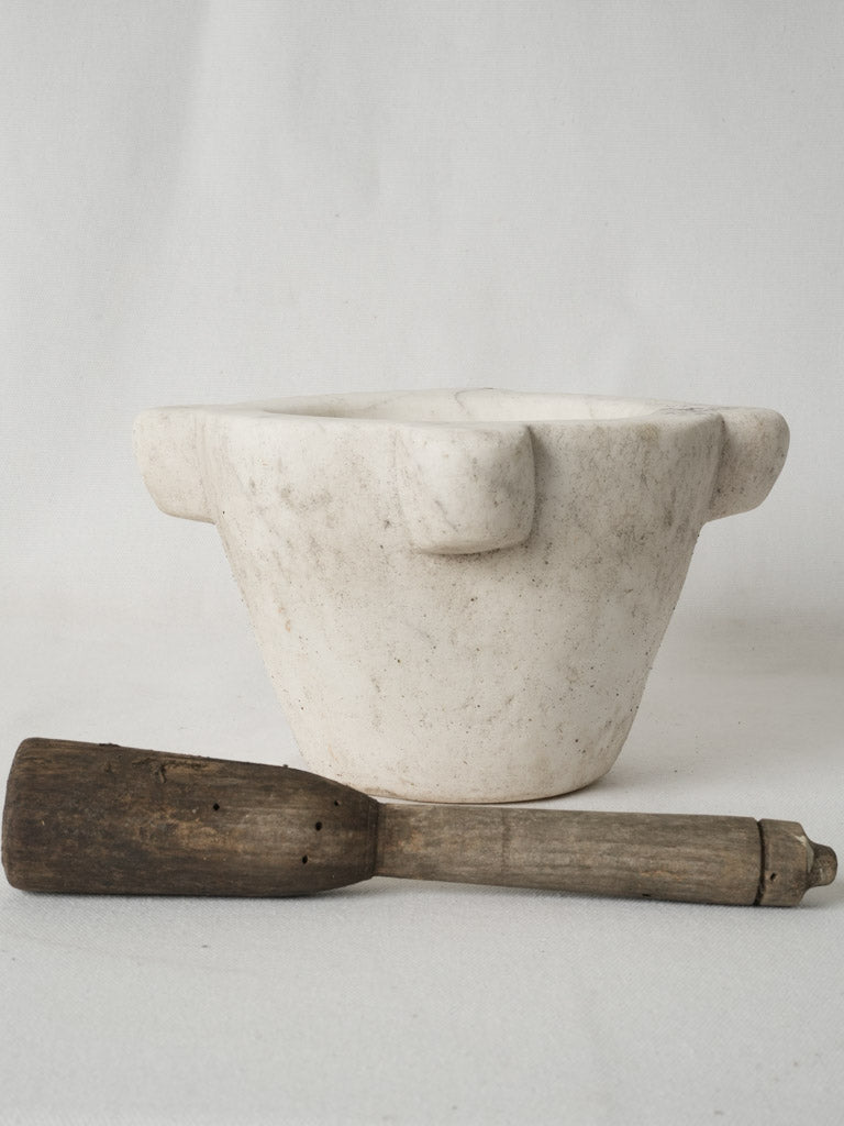 Classic old marble and wooden pestle