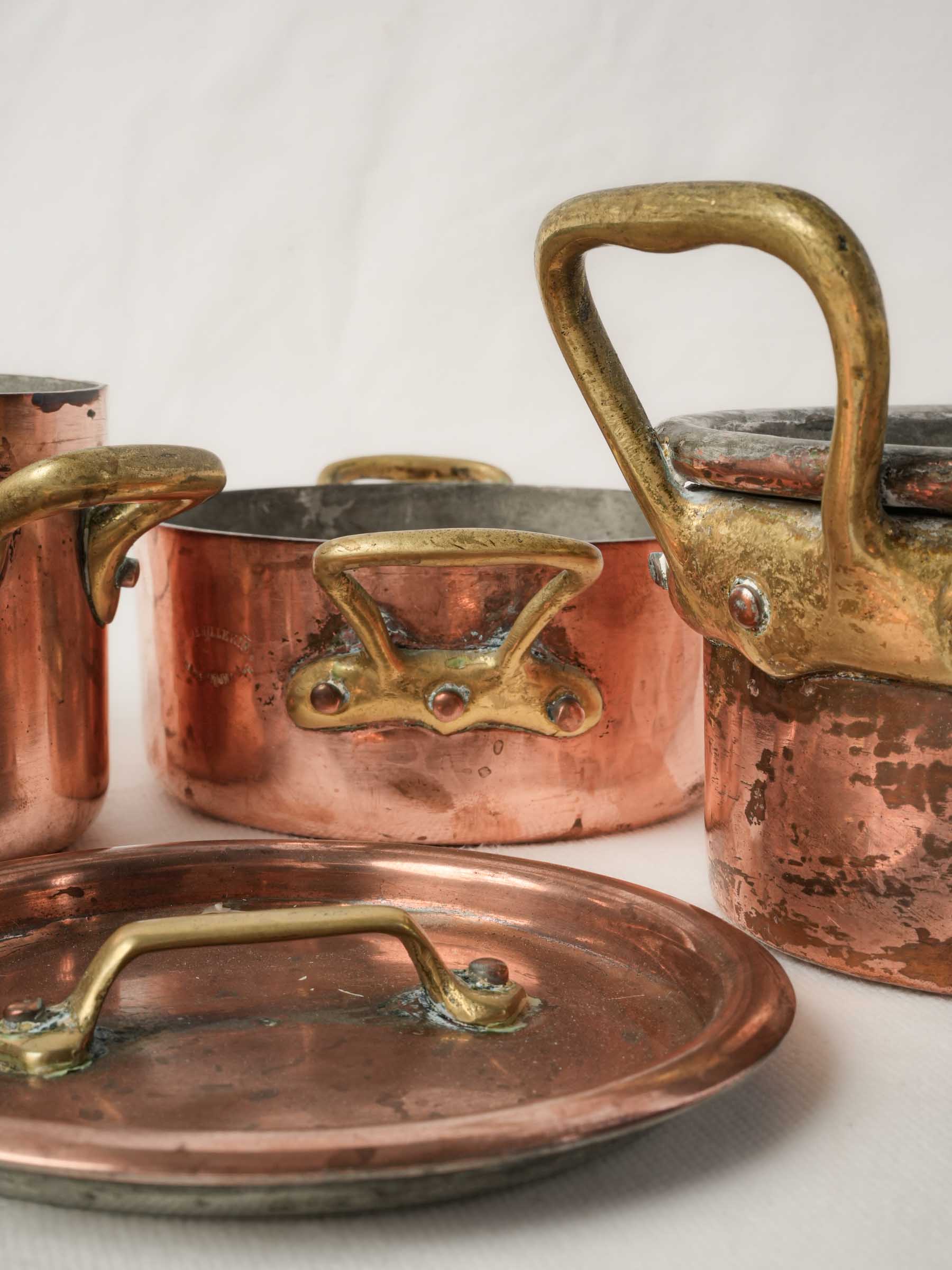 Set of four Copper Lidded Casseroles with Fish Kettle