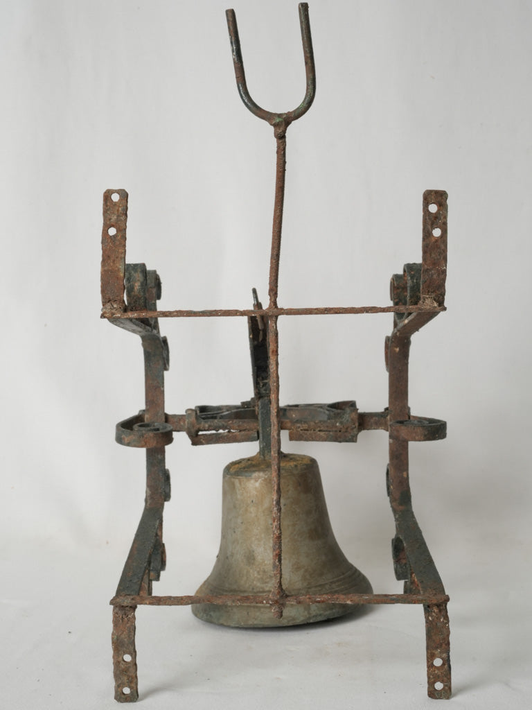 Rustic wrought iron bracketed bronze bell