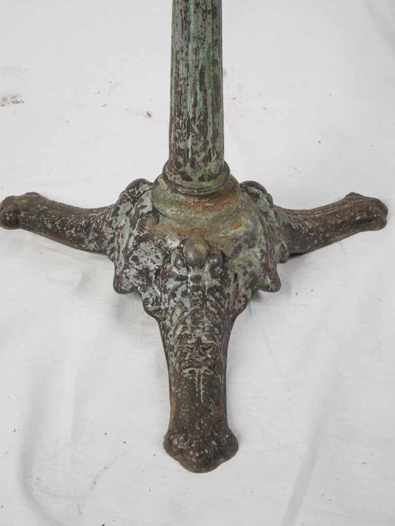 Timeworn cast-iron guéridon table  