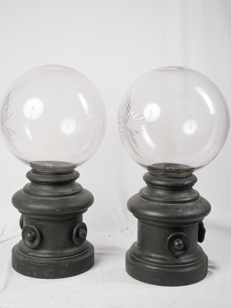 Monumental ebonized wood show globes