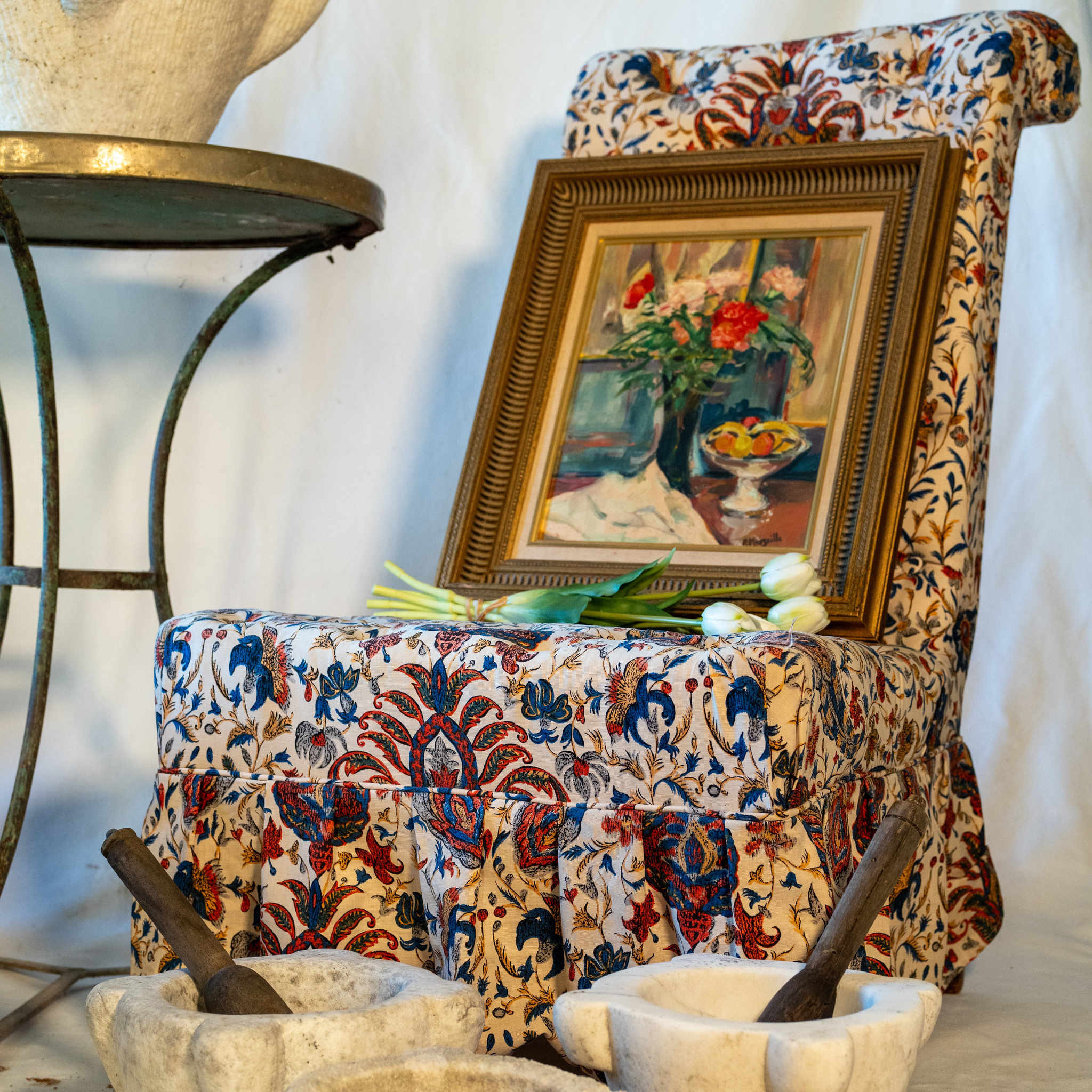 Pair of upholstered chairs w/ ruffle skirts & front wheels