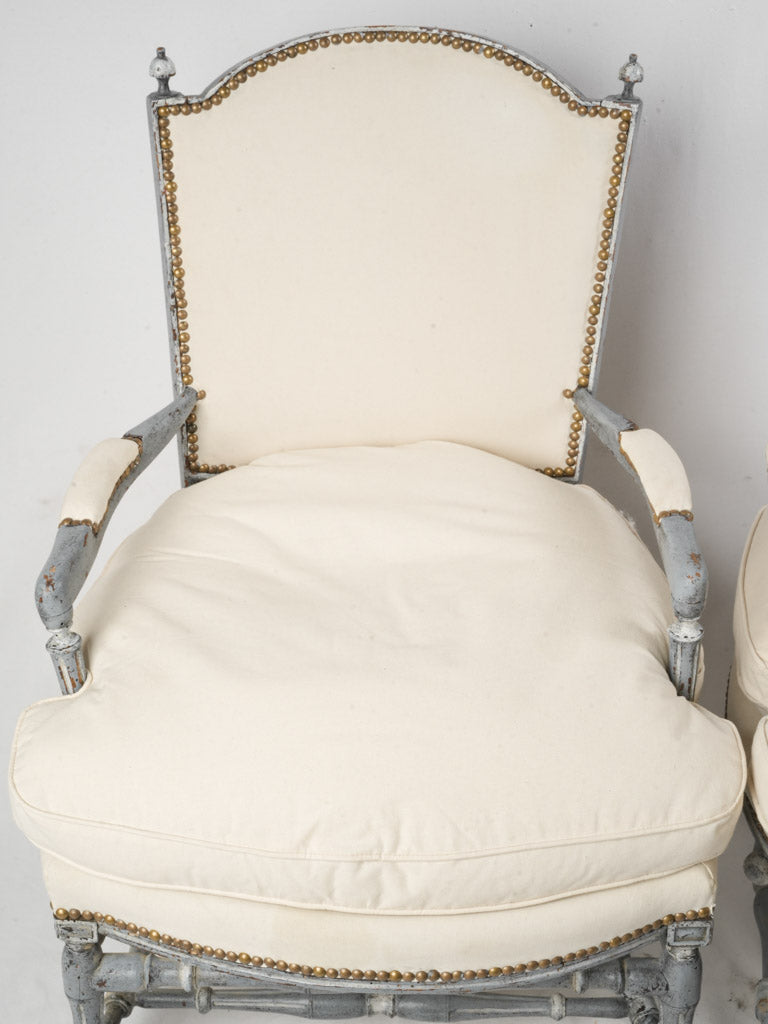 Timeworn hardwood framed armchairs