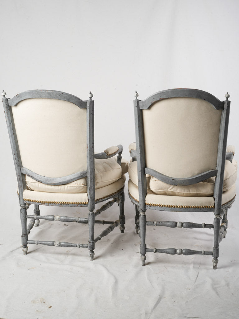 Decorative finial-topped armchairs