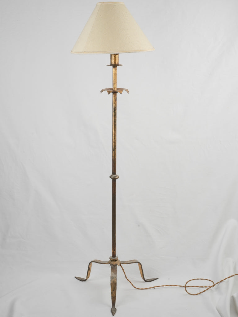 Timeless slender gold tripod lamp