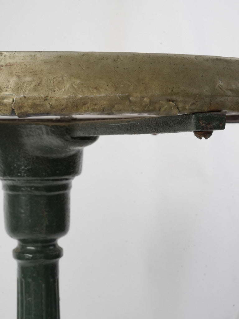 Timeworn cast-iron café table  