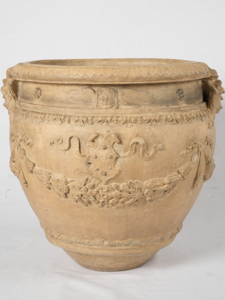 Elegantly stamped Siena terracotta urn