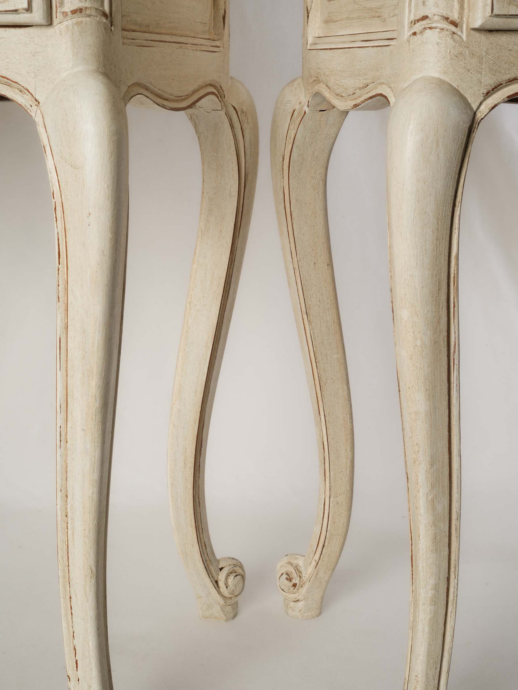Slender cabriole-leg side tables