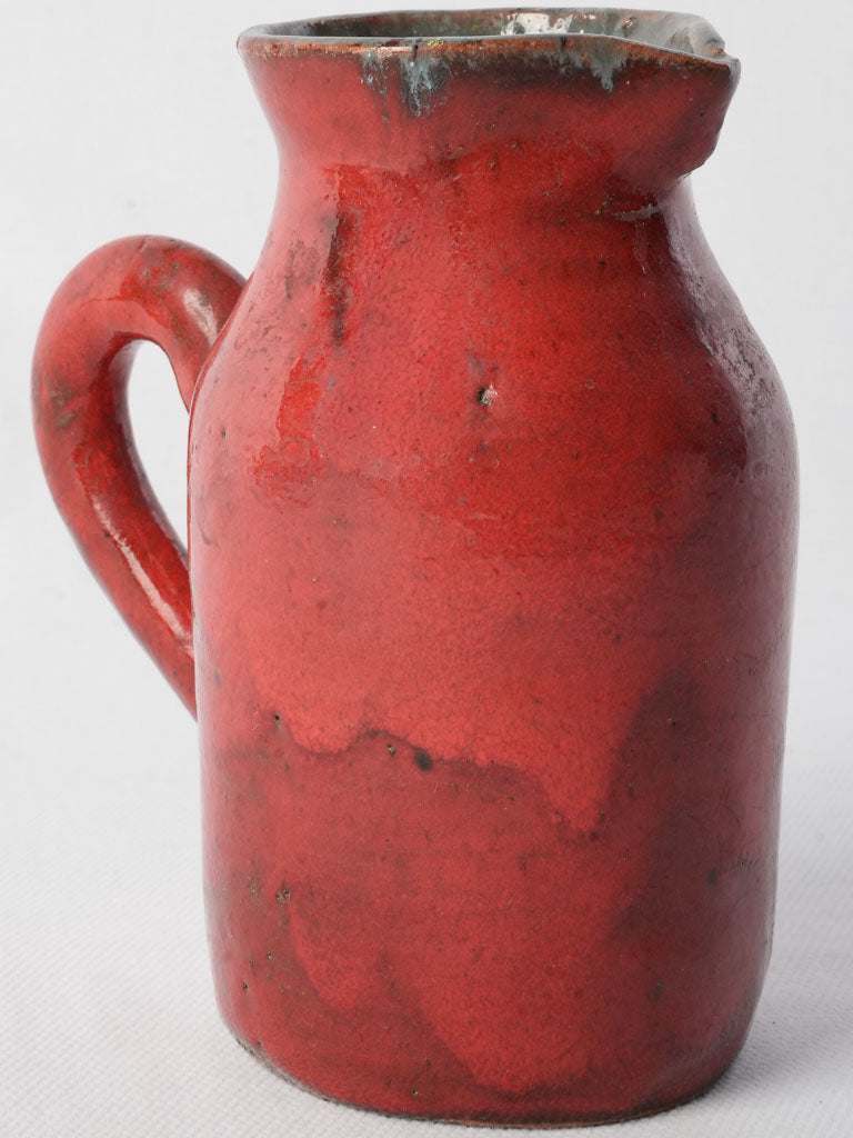 Retro red-glazed ceramic jug  