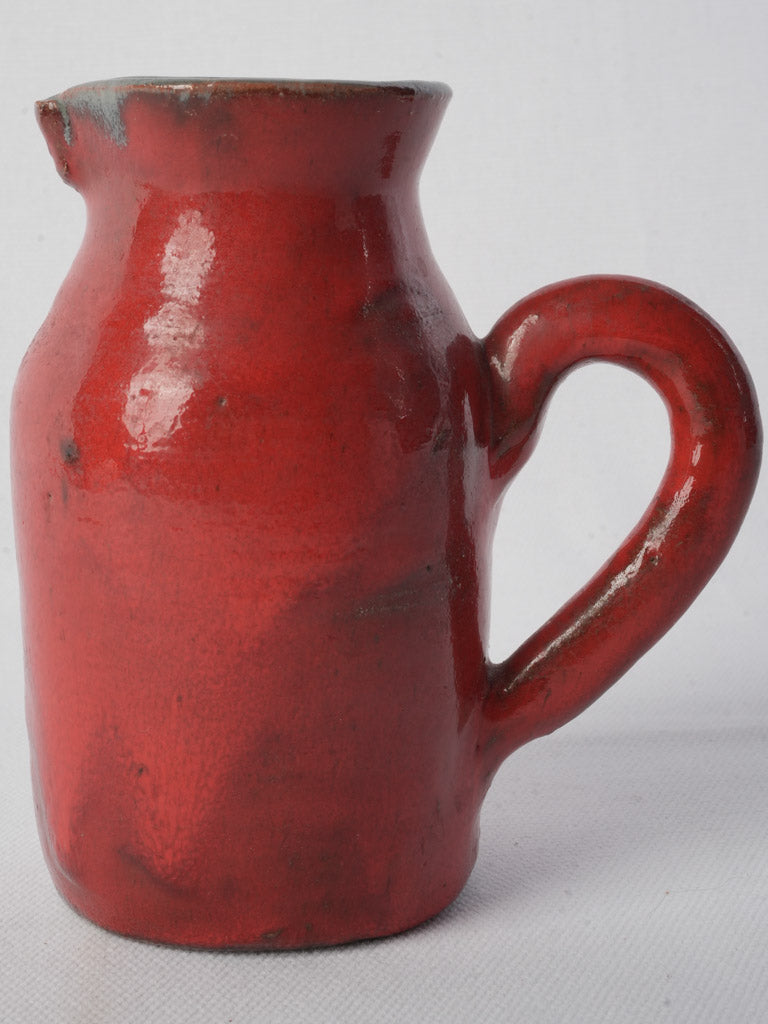 Lustrous red pottery pitcher  
