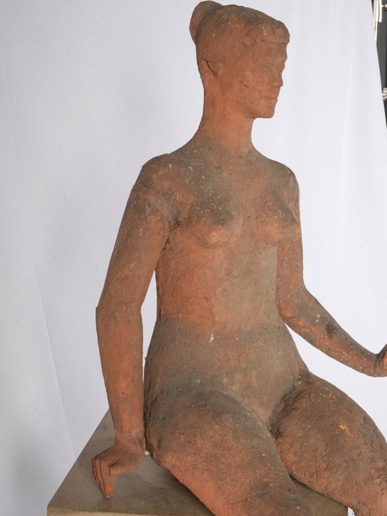 Earthen warmth seated figure  