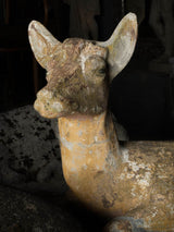 Weathered grey stone deer figurines