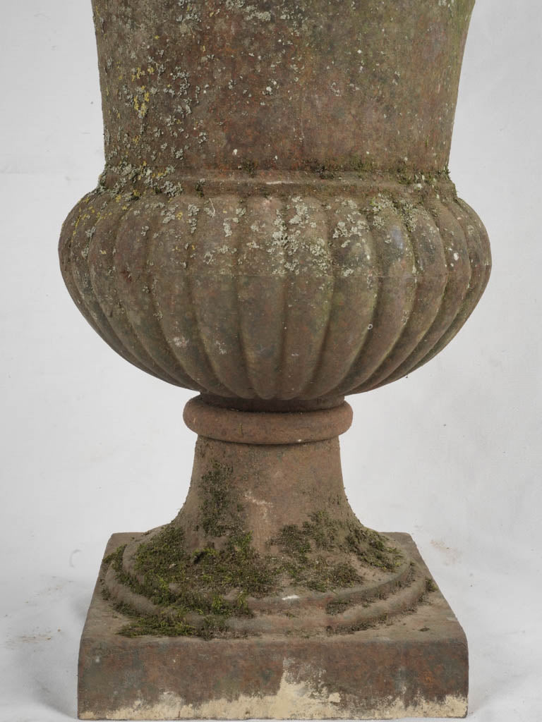 Aged cast iron outdoor urn