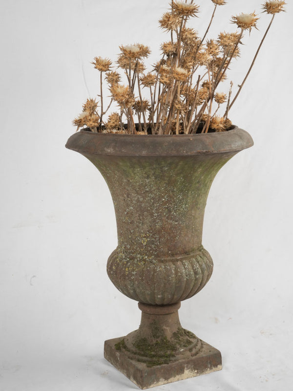 Antique mossy green garden urn