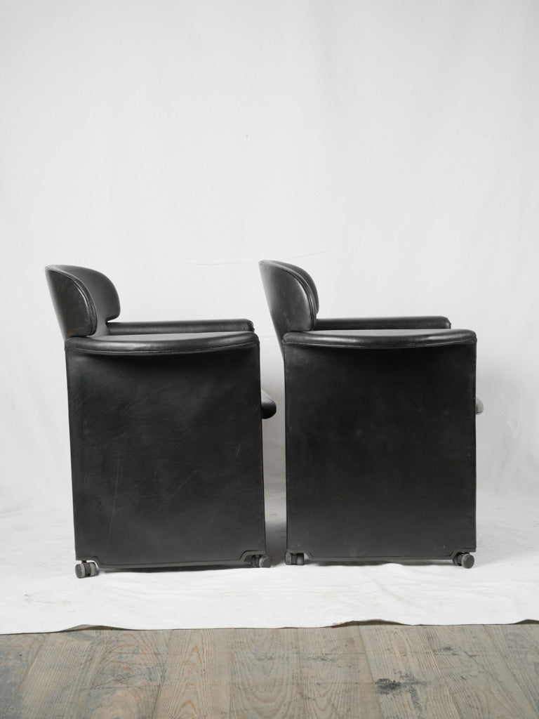 Vintage designer armchairs in black leather