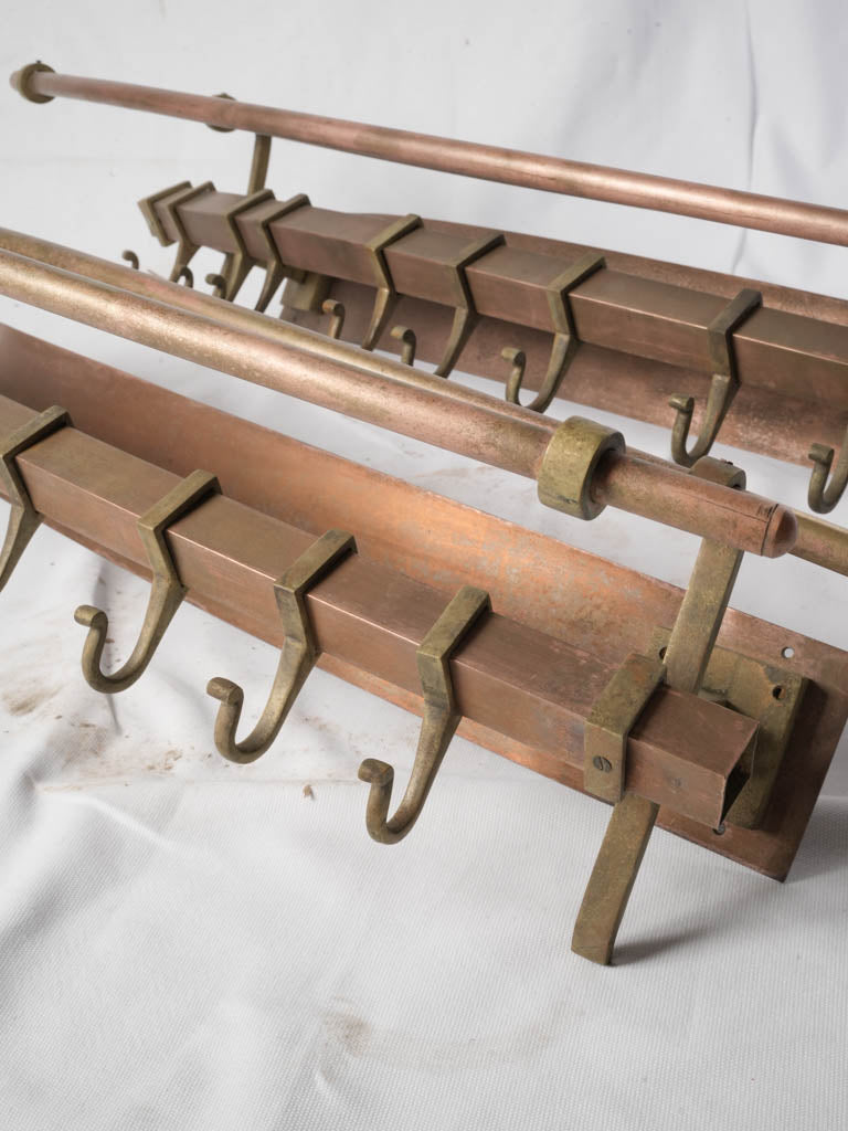 Warm toned antique brass racks  