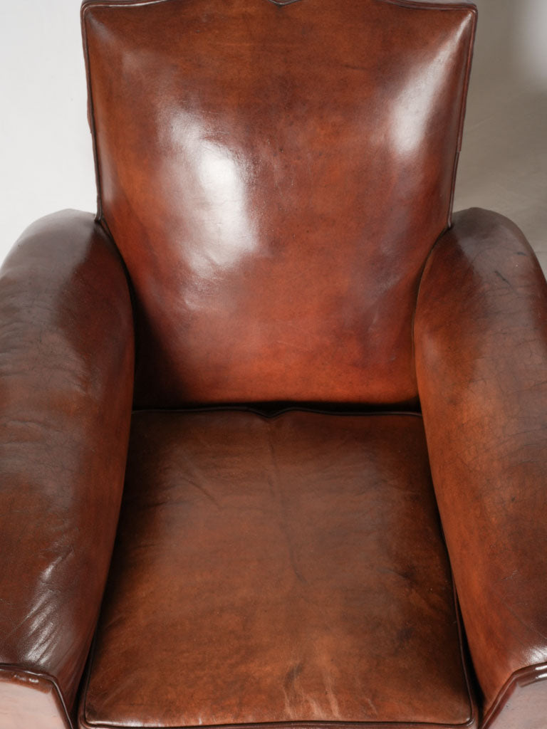 Time-worn 1930s leather armchairs