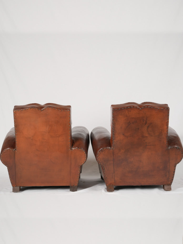Elegant studded 1930s French club chairs