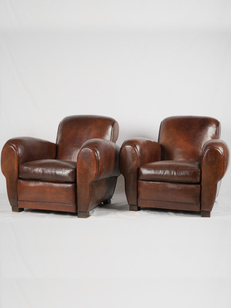 Antique oversized French leather club chairs