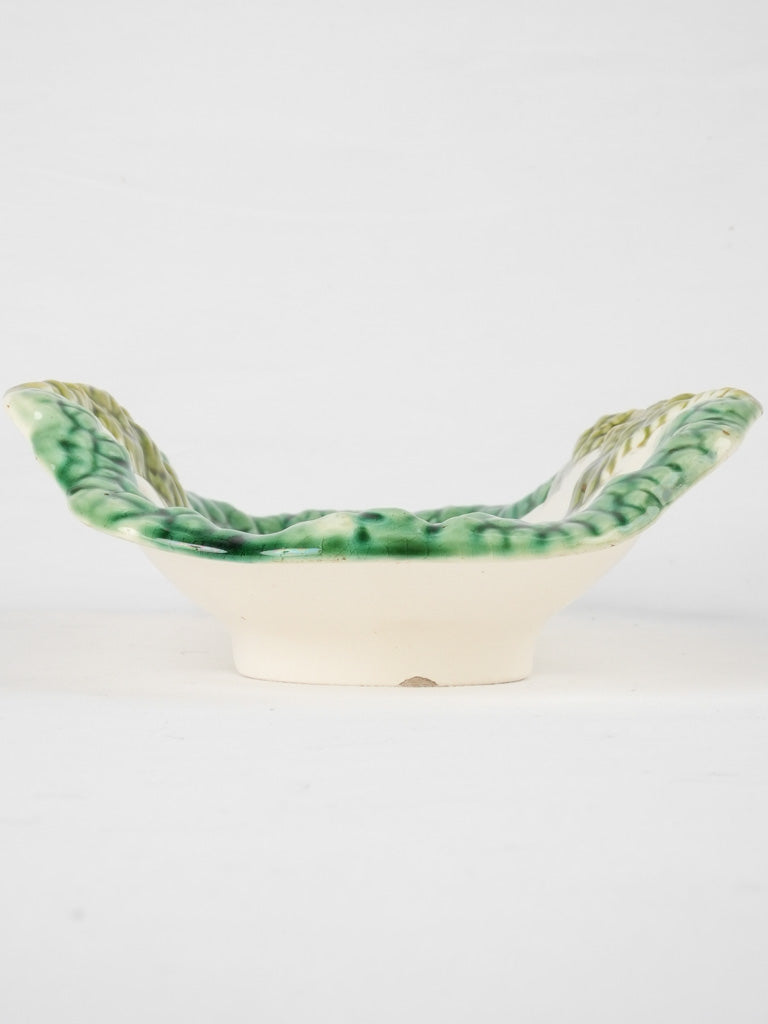 Historically awarded art pottery cradle
