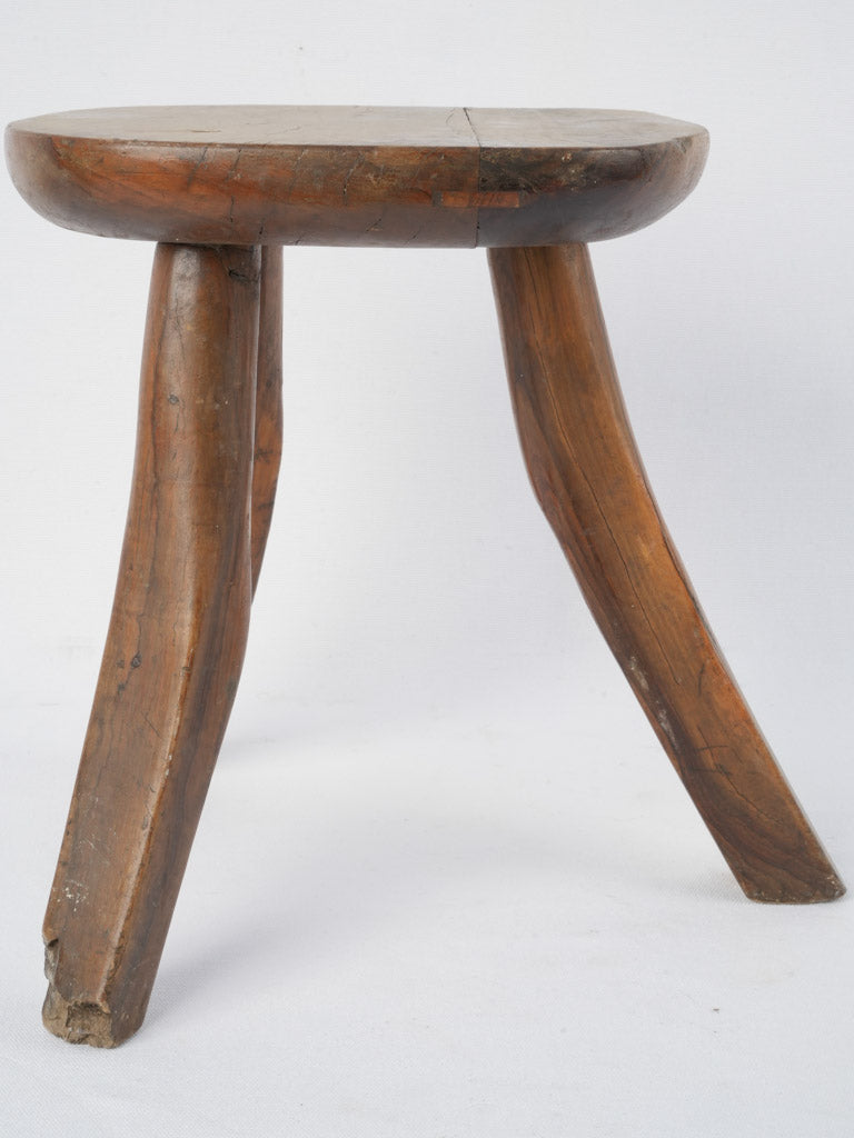 Weathered three-legged stool, vintage, nostalgic 