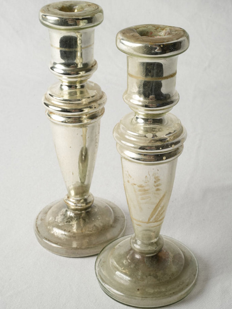 Time-softened mirrored glass candlesticks  