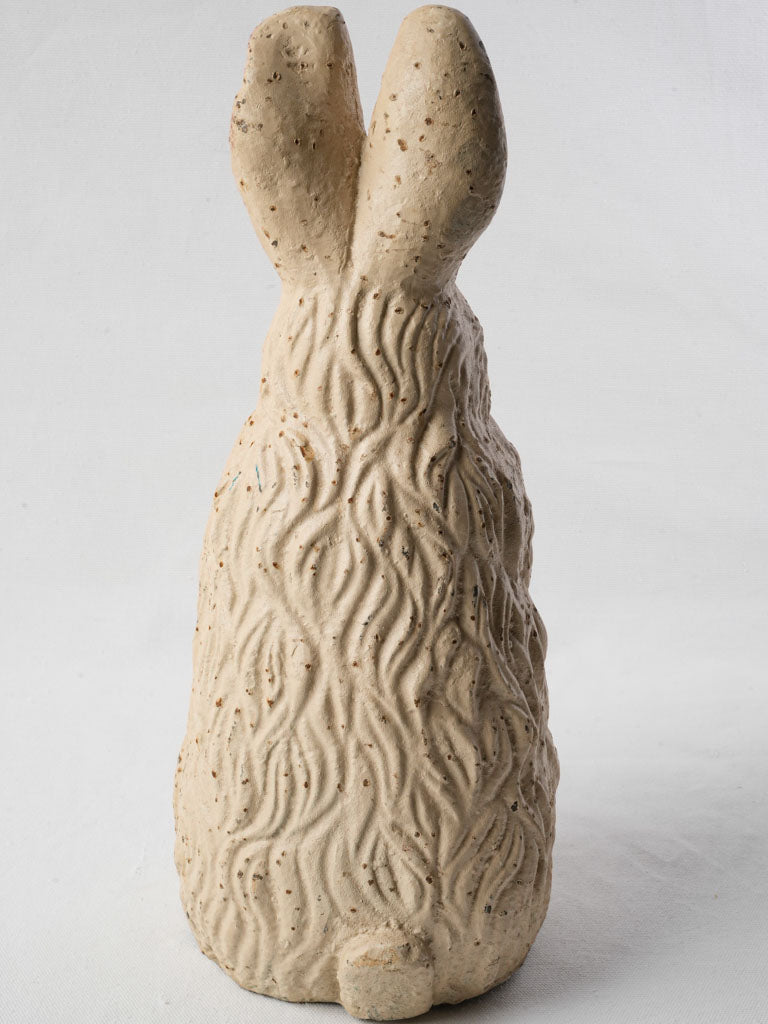 Rustic cream-colored rabbit sculpture