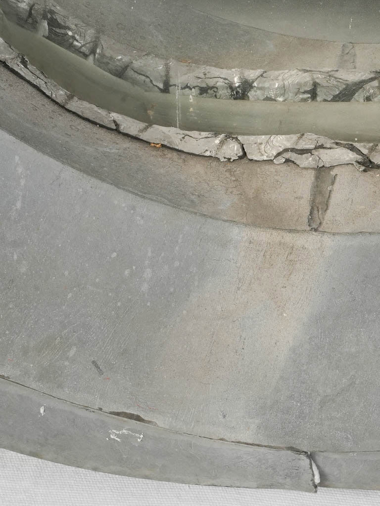 Hand-formed lead-grey zinc mirror  