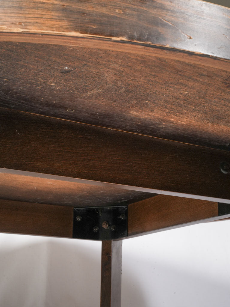 Geometric dark-stained wooden table  