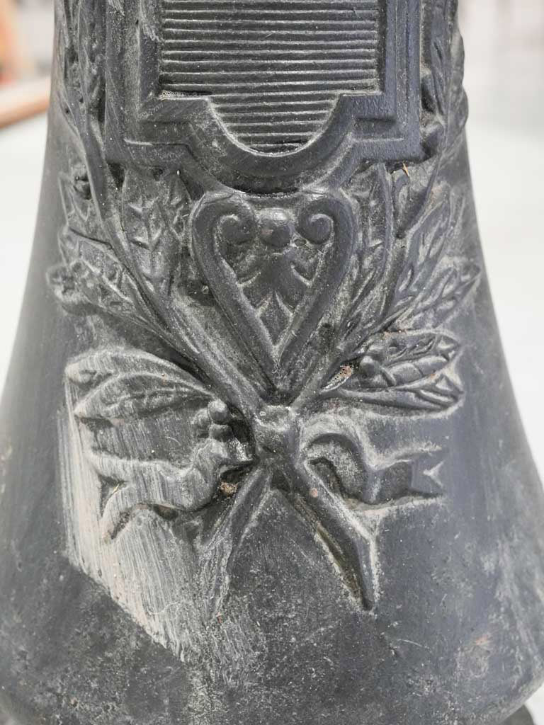 Ornate scrolling iron lamp columns  